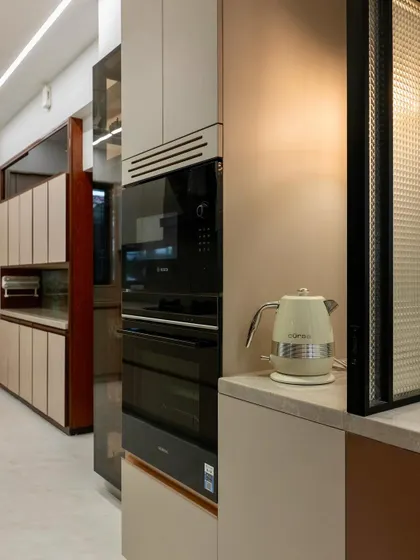 The appliance nook in use, with a kettle ready for a cup of tea. It’s these small, thoughtful corners that make a home feel truly lived-in and designed for real life.