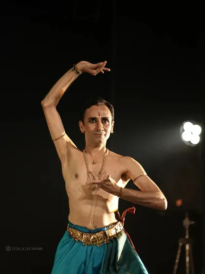 A moment of stillness and expression during the Soorya Festival. The precise hand gestures, or mudras, are a language in themselves, each one conveying a specific meaning or emotion within the story.