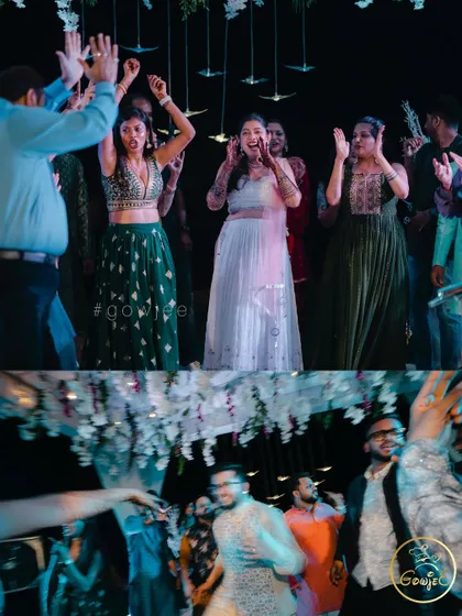 Guests dancing with high energy at an outdoor reception party.