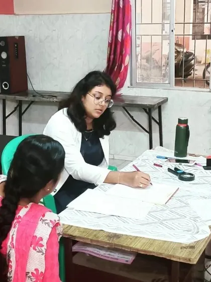 Listening to a patient's concerns at a free skin camp organized by Elegance Skin Clinic.