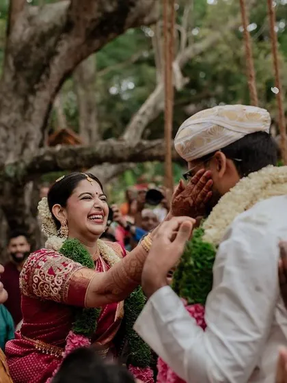 A candid moment of pure joy and fun during the wedding rituals. Capturing the genuine connection and playfulness between the couple is what our story-driven videography is all about.