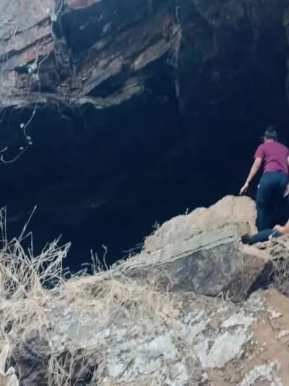 The challenging entrance to one of the caves, requiring some scrambling over rocks.