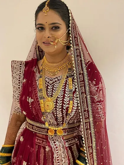 This bride is slaying in her North Indian lehenga. For her third look of the day, we went with a classic red lehenga, complete with a dupatta setting and matching jewelry.