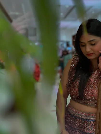 A candid, artistic shot in a beautiful ethnic outfit. I appreciate the small, quiet moments amidst the chaos of an event.
