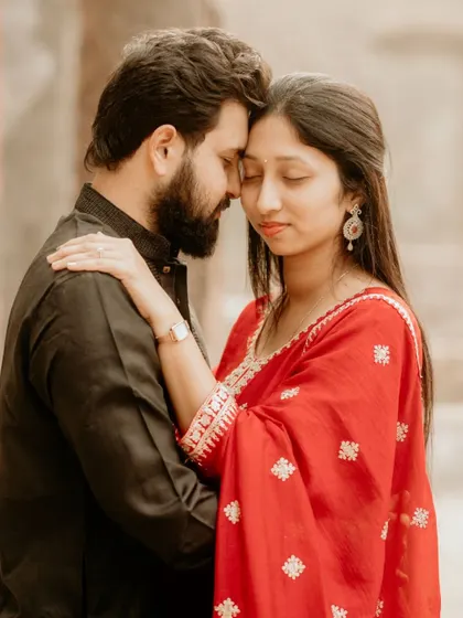 An intimate and serene portrait from a pre-wedding shoot at a historic location. The soft light and close embrace create a feeling of timeless romance.