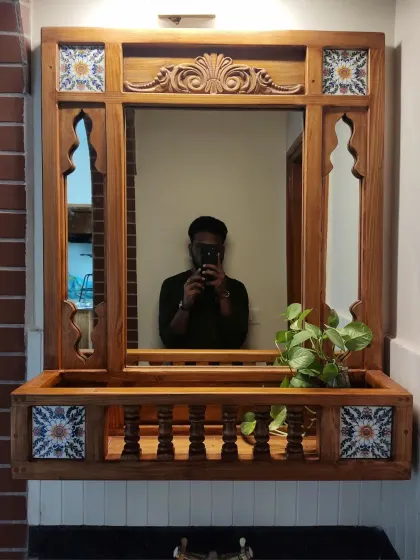 Every creative work reflects its designer, quite literally. This shot captures the reflection in the magnificent jharokha mirror, showcasing its depth and intricate craftsmanship.