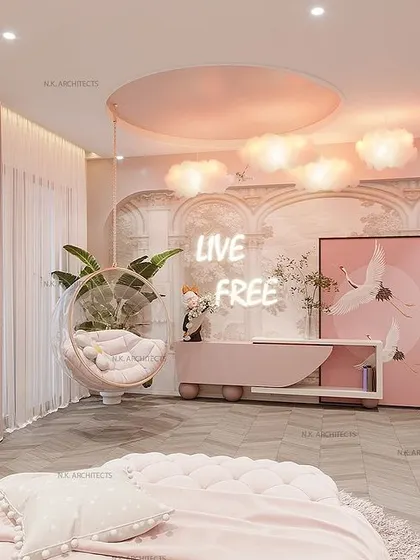 Another view of the pink bedroom, showcasing the study area and a neon "Live Free" sign, adding a modern and empowering touch to the whimsical design.