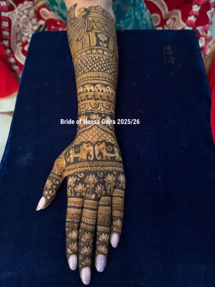 Elegance in every stroke. This back-of-hand design features a royal peacock, traditional elephants, and lotus motifs, all balanced perfectly for a graceful and timeless bridal look.