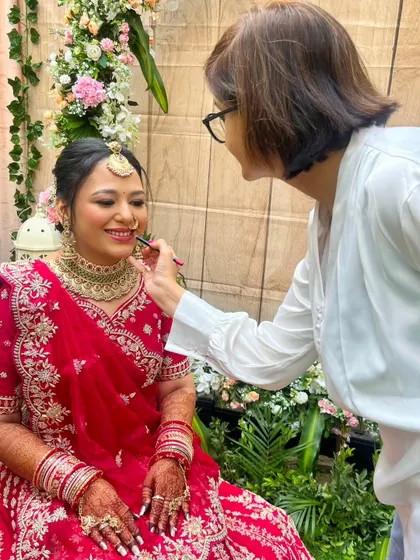 The joy on both our faces is evident. Seeing the final look come together and the bride's happiness is the most rewarding part of my work.