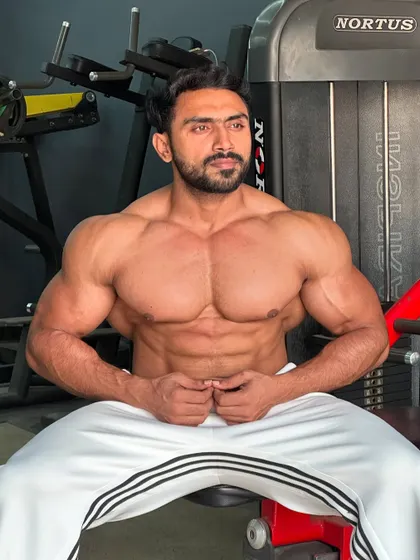 Another relaxed pose, showing the chest and ab definition.