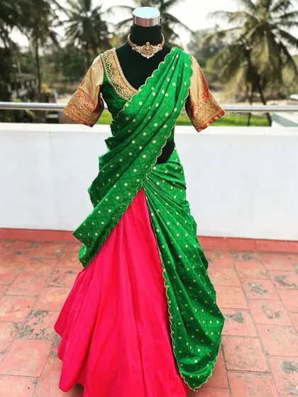 The scalloped green dupatta with gold polka dots is a lovely detail.