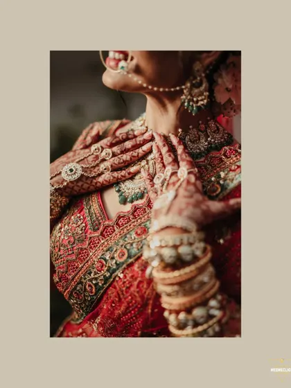 A close-up shot focusing on the intricate details of the bride's hands, mehendi, and jewelry.