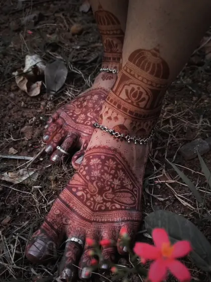A close-up of the stained foot mehndi, showing the deep, dark color achieved with natural henna.