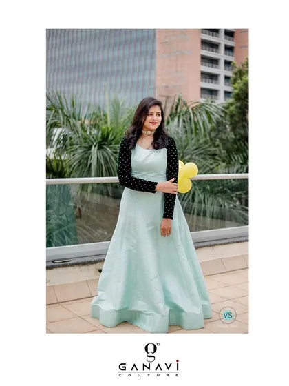 This single-piece gown with an attached jacket panel offers an elegant and seamless look, combining the feel of layers with the ease of one garment.