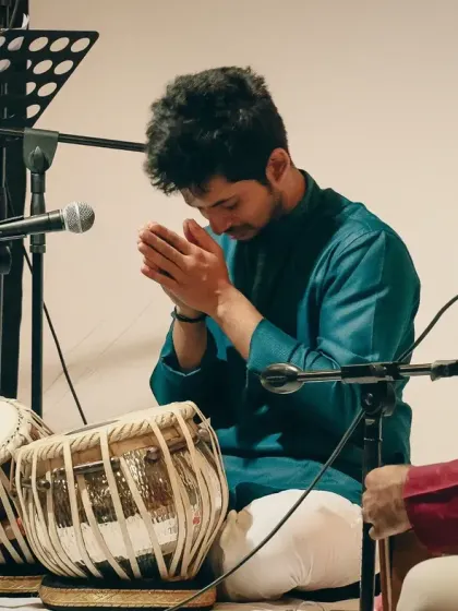 A moment of pranaam, or respectful greeting, to the stage and my instruments before starting my performance. It is a gesture of gratitude for the music.