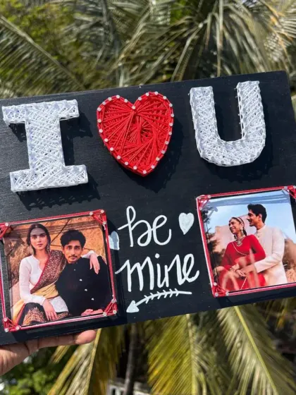 An "I Love You" string art frame, perfect for Valentine's Day or an anniversary. It has space for two photos to celebrate your relationship.
