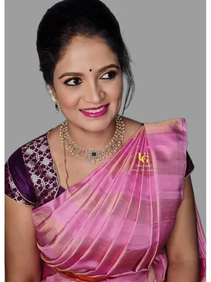 Navya looking absolutely gorgeous in her soft glam makeover. The side profile shows off her radiant skin and the beautiful pearl necklace that completes her look.