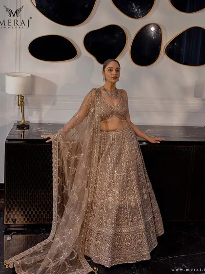 This beige lehenga is a perfect blend of classic beauty and contemporary glamour, designed for the modern bride.