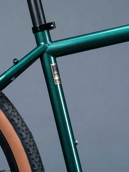 The clean lines of the Reynolds 525 steel frame. Notice the mounting points for luggage racks, a critical feature for any serious touring or bikepacking bicycle.