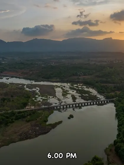 The sun begins its descent over Tahuli Peak at 6:00 PM. A beautiful, calm evening in Badlapur.