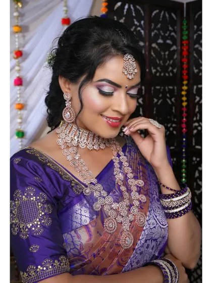 This model is wearing a beautiful rose gold plated CZ set. The intricate design and warm tone make it a unique and stylish choice for a reception.