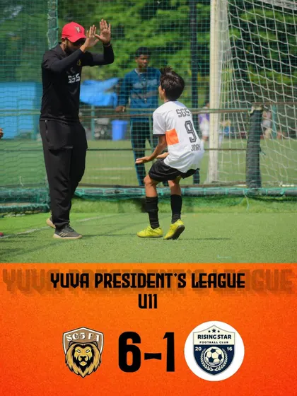 A high-five between coach and player after a goal in our U11 team's 6-1 win. We celebrate every success together.