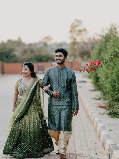 This couple, coordinated in beautiful green outfits, takes a stroll during their Mehendi ceremony. I help guide every detail to create a cohesive and visually stunning wedding story.