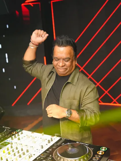 A shot of me on the decks, feeling the beat and getting ready to drop the next track.