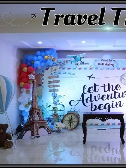 A wide view of the travel-themed stage, ready for photos.