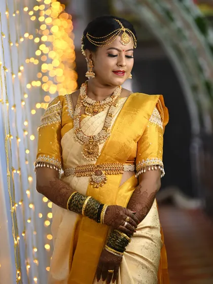 Bride Pooja looking absolutely stunning in her custom Aarvi Vastra creation. The pearl and stone work on the sleeves adds a touch of glamour.