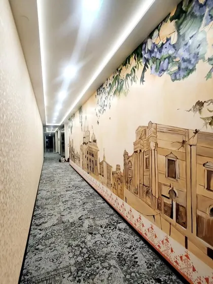 This long corridor at Prestige Techno-Star in Whitefield, Bengaluru, was transformed with a mural depicting the city's iconic landmarks and flora. It turns a simple walkthrough into a visual journey.