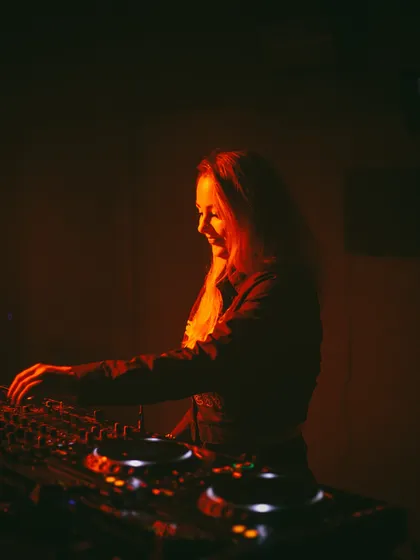 A smile while I'm mixing. I genuinely love what I do, and I think that energy translates to the dance floor.
