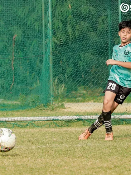 A clean strike on a loose ball, aimed towards the goal.