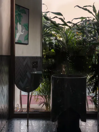 An identical view of the powder room, where the boundary between inside and outside feels completely blurred.