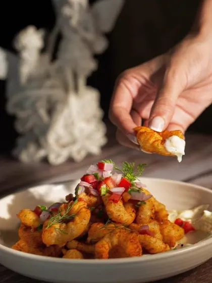 My crispy prawn tapas, perfect for dipping into a creamy sauce. It's an irresistible bite from my new European-inspired menu.