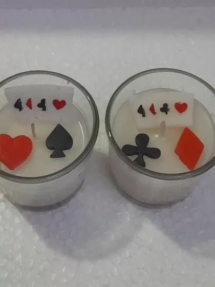 Light up your game night with a little poker magic. These card-inspired tealight candles feature wax suits of cards and are perfect for a lucky glow.