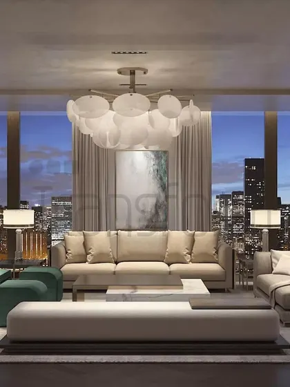 In this DLF Camellias residence, I crafted a living room that balances modern sophistication with deep comfort. The neutral palette creates a serene backdrop for the city skyline, while the plush teal accent chairs and bespoke shelving provide both personality and function.