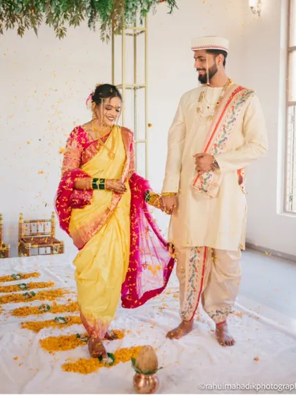The 'saptapadi' or seven steps, a key ritual where the couple takes their first steps together as husband and wife.