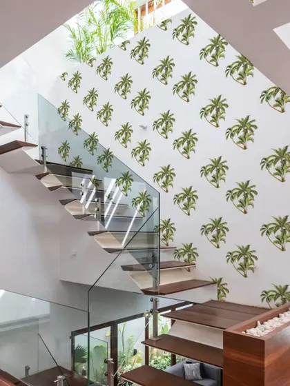 A staircase wall featuring our Beach Green Palm Tree wall sticker pattern adds a touch of the tropics to your home’s architecture. The design creates a fun and vibrant journey between floors.