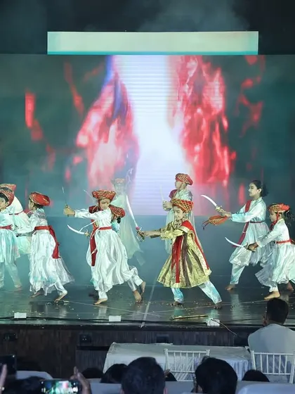 Our young warriors in action during the Tanaji act, using prop swords to create a dynamic and engaging performance.
