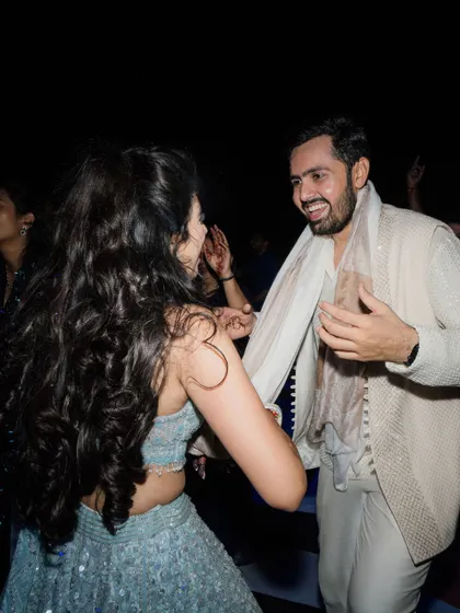A portrait of the groom, his ivory sherwani and layered look perfect for a magical sangeet night.