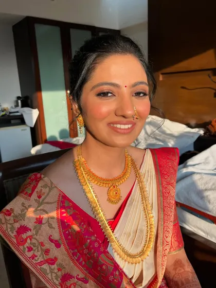 The golden hour sun kisses her skin, highlighting the beautiful, glowing finish of the makeup. This look is all about natural radiance.