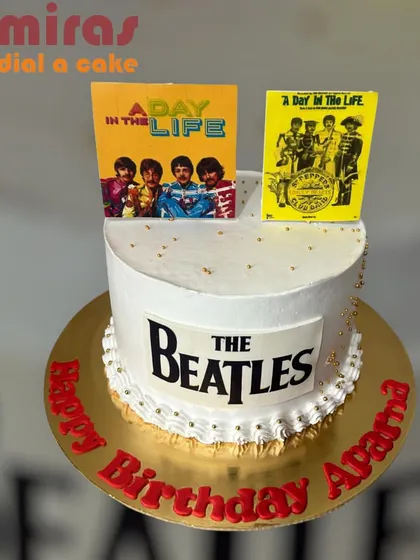 A cake for a classic rock fan, this design celebrates The Beatles. It features edible images of their album covers and the iconic band logo, perfect for a musical birthday.
