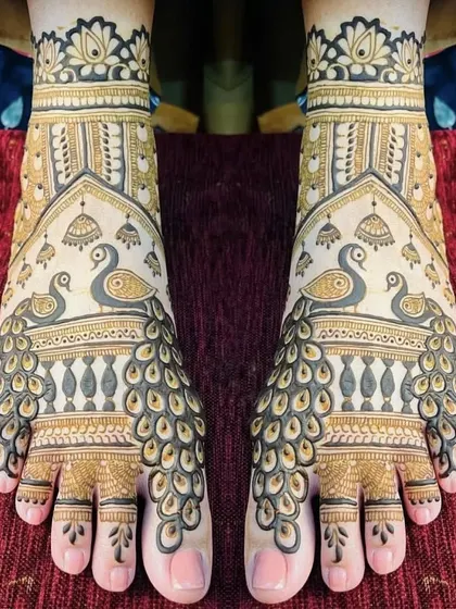 A mirrored peacock design for the feet, where the feathers create a beautiful fan-like pattern. This is a very popular choice for brides.
