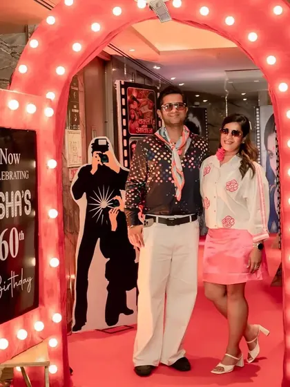 Guests arriving in their best retro outfits, ready for a night of celebration.