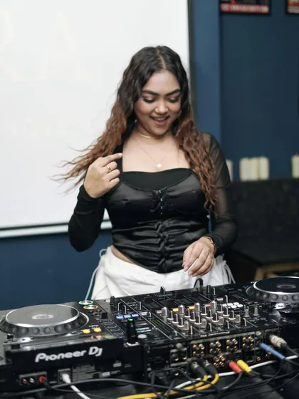 A candid shot of me smiling and mixing, finding bliss in every moment.