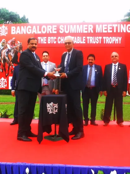 Mr. Arvind S. Katarki presents The B.T.C Charitable Trust Trophy to the owners of Imperial Blue.