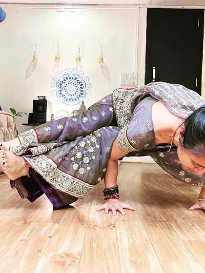 Practicing yoga in a saree. This shows that yoga is not about the clothes you wear but about the connection you feel. Here, I am holding a side crow pose.