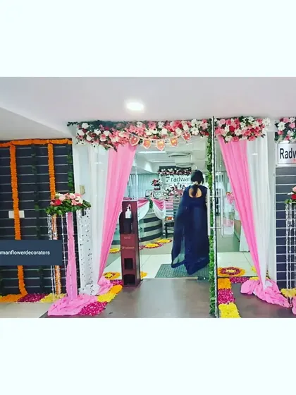 Here’s how we transform a corporate office entrance for a festival. For Radware India, we used bright pink and white fabric drapes, floral pillars, and a traditional flower path to create a welcoming and celebratory atmosphere for employees and visitors.