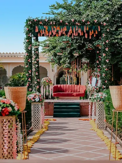A view of the main stage and seating area for an outdoor mehendi. This shot captures the overall vibe and aesthetic of the event decor.